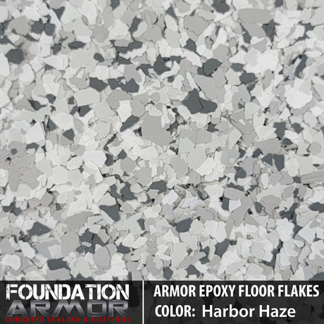 Frosted noir Armor Epoxy Floor Flakes with textured appearance, showing a decorative epoxy floor coating with black and gray flakes.